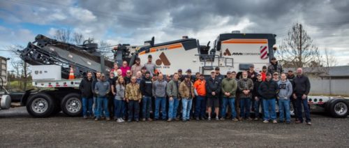 Anrak Crew standing in front of large truck